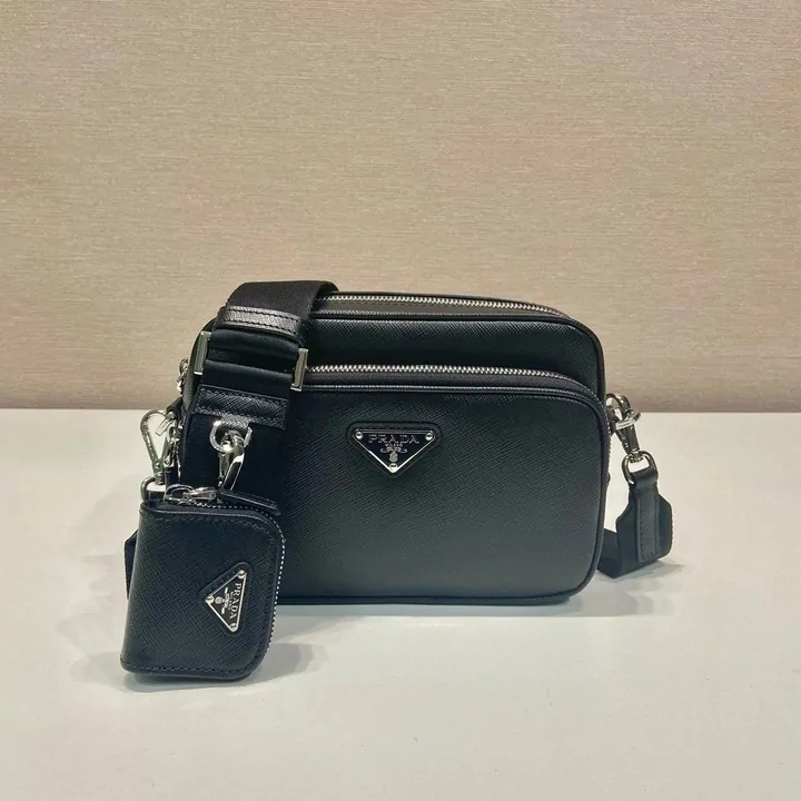 black leather camera bag with a small detachable pouch