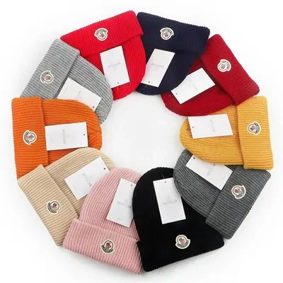 knit beanies in eight colours arranged in a ring
